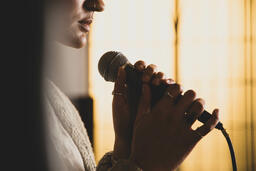 Worship Leader Holding Microphone  image 5