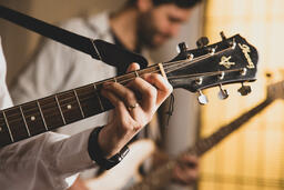 Person Playing Acoustic Guitar  image 1