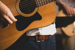 Person Playing Acoustic Guitar  image 5