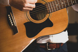 Person Playing Acoustic Guitar  image 3