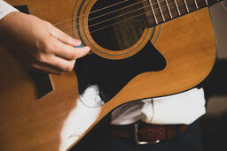 Person Playing Acoustic Guitar  image 4