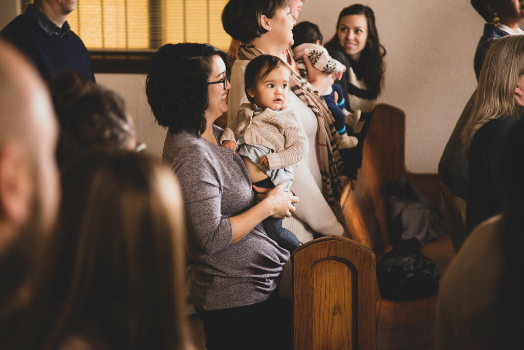 Mother Holding Baby at Church large preview