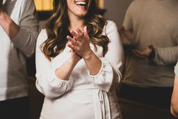 Woman Clapping During Worship  image 1