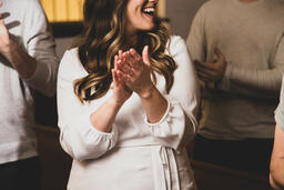 Woman Clapping During Worship  image 2