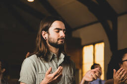 Man with Hands Raised During Worship  image 2