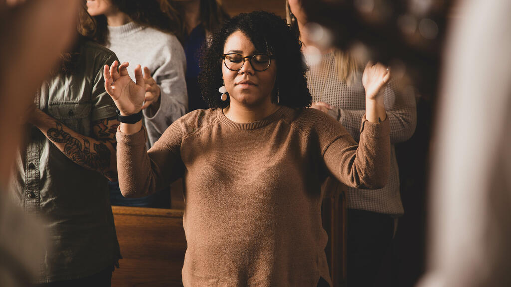 Woman Worshipping on a Sunday Morning large preview