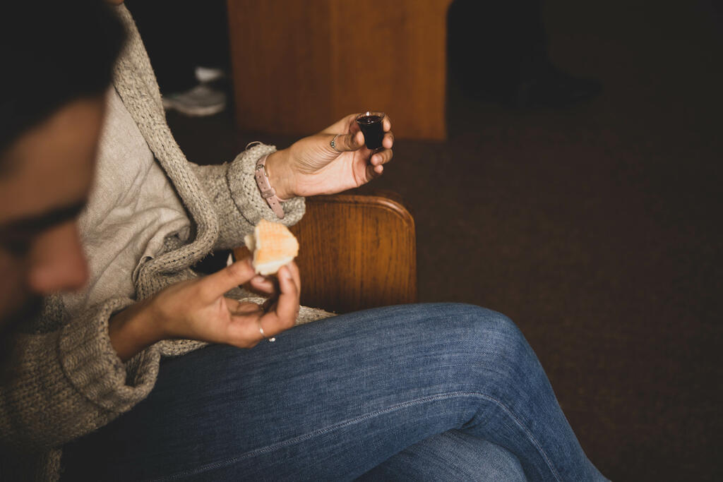 Woman Holding Communion Elements large preview