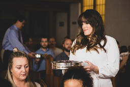 Woman Passing Out Communion  image 2