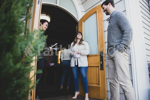 Greeters Welcoming a Congregation Member to Church