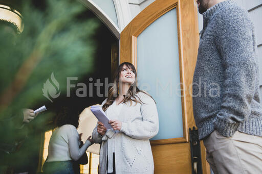 Greeter Welcoming a Congregation Member to Church