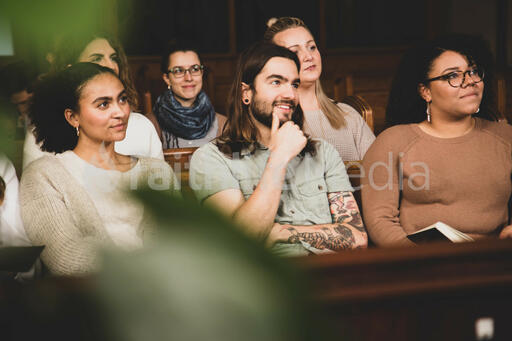 Congregation Members Listening During Church Service