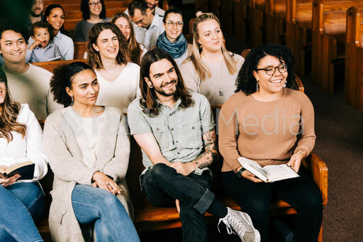 Congregation Members Laughing During Church Service