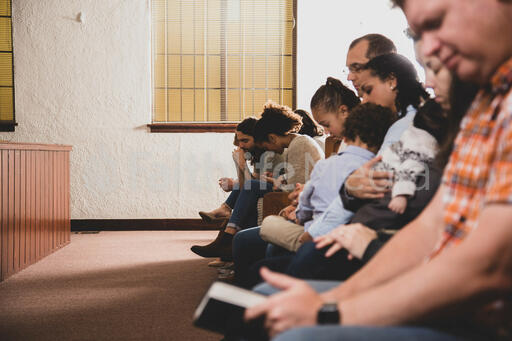 Congregation Members Praying Together