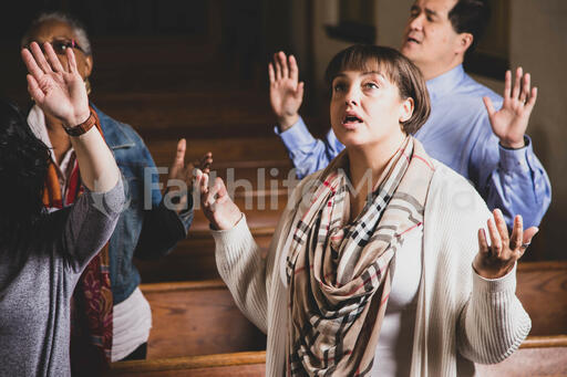 Woman Worshipping on a Sunday Morning