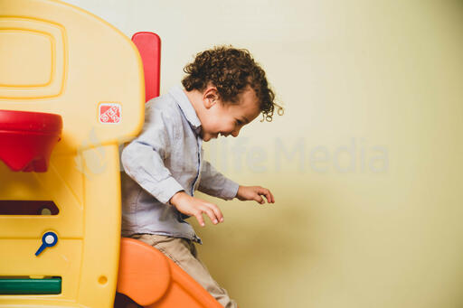 Young Boy on a Slide