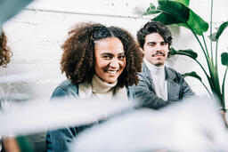 Young People Sitting Together and Laughing  image 2