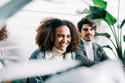 Young People Sitting Together and Laughing  image 1