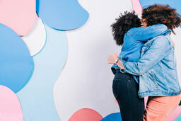 Young People Hugging and Laughing  image 1