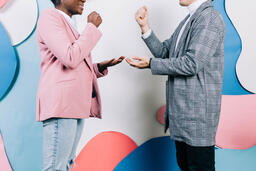 Young People Playing Rock Paper Scissors  image 3