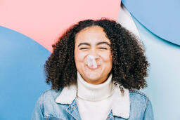 Young Woman Blowing Bubble Gum  image 1