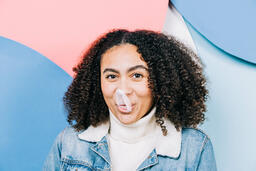 Young Woman Blowing Bubble Gum  image 2
