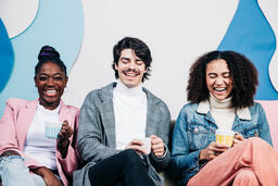 Young People Drinking Coffee and Laughing Together  image 3