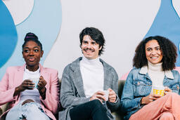 Young People Drinking Coffee and Laughing Together  image 1