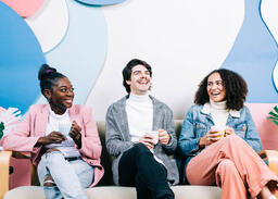 Young People Drinking Coffee and Laughing Together  image 2