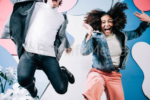 Young People Jumping and Laughing