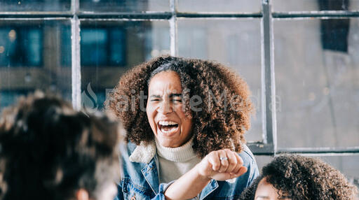 Young Person Laughing with Friends