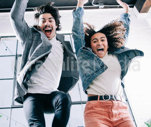 Young People Laughing and Jumping