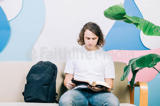 Young Man Reading the Bible