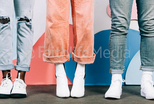Young People Standing in White Shoes