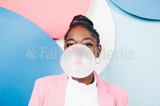 Young Woman Blowing Bubble Gum