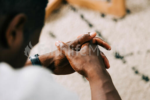 Man Folding Hands in Prayer