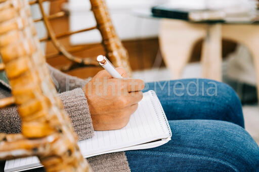 Woman Taking Notes during Small Group