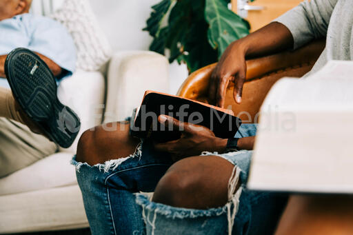 Man Reading Bible at Small Group