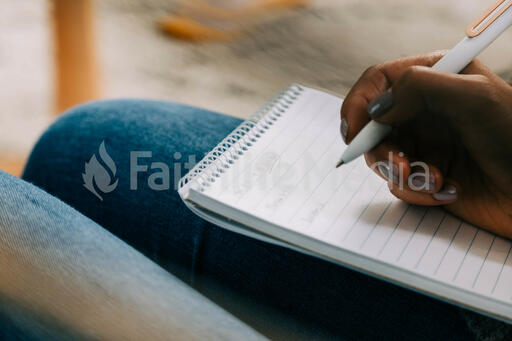 Woman Taking Notes in Notebook