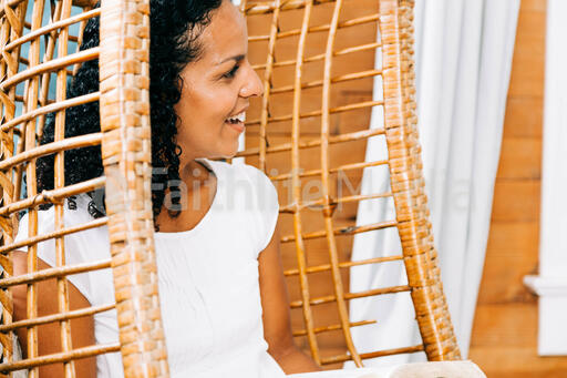 Woman Smiling with an Open Bible