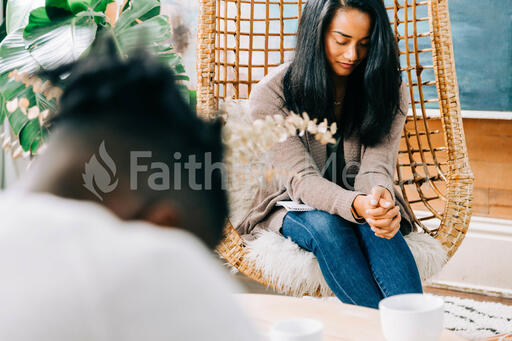 Woman Praying at Small Group