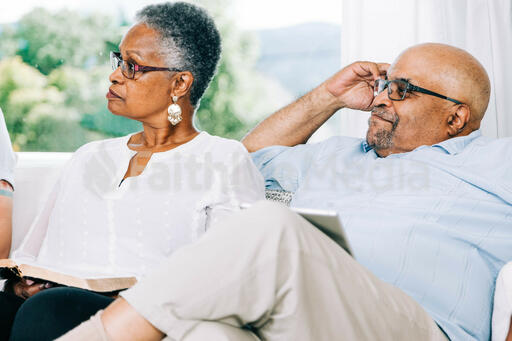 Married Couple Listening during Small Group Discussion
