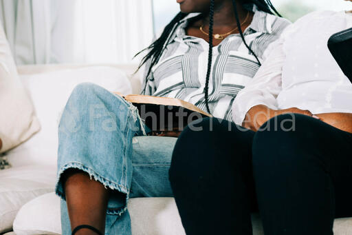Woman with Open Bible on her Lap at Small Group