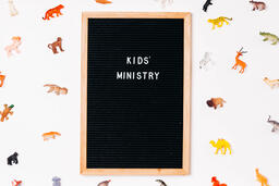 Kids' Ministry Letter Board Surrounded by Toy Animals  image 1