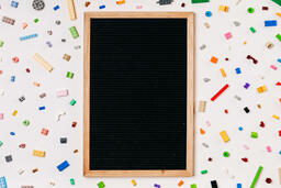 Blank Letter Board Surrounded by Legos  image 1