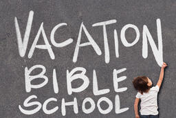 Boy Writing Vacation Bible School with Chalk  image 2