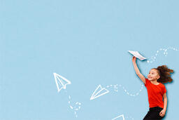 Girl Throwing Illustrated Paper Airplanes  image 1