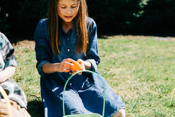 Girl Opening One of Her Easter Eggs  image 1