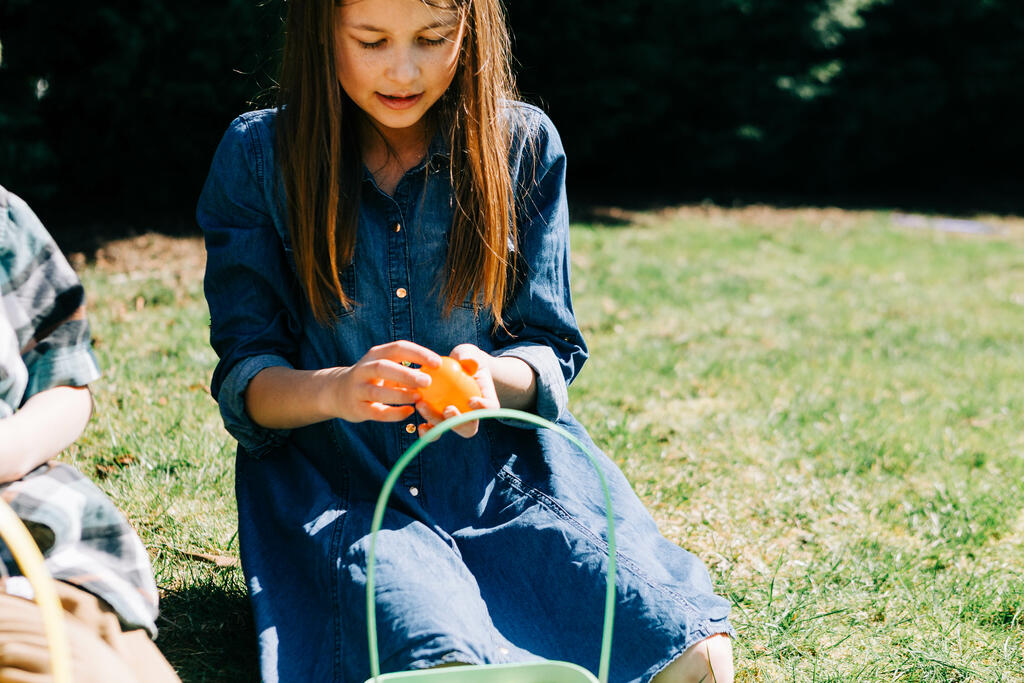 Girl Opening One of Her Easter Eggs large preview