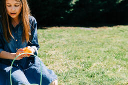 Girl Opening One of Her Easter Eggs  image 2