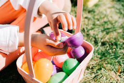 Child Finding a Piece of Candy in Her Easter Egg  image 3